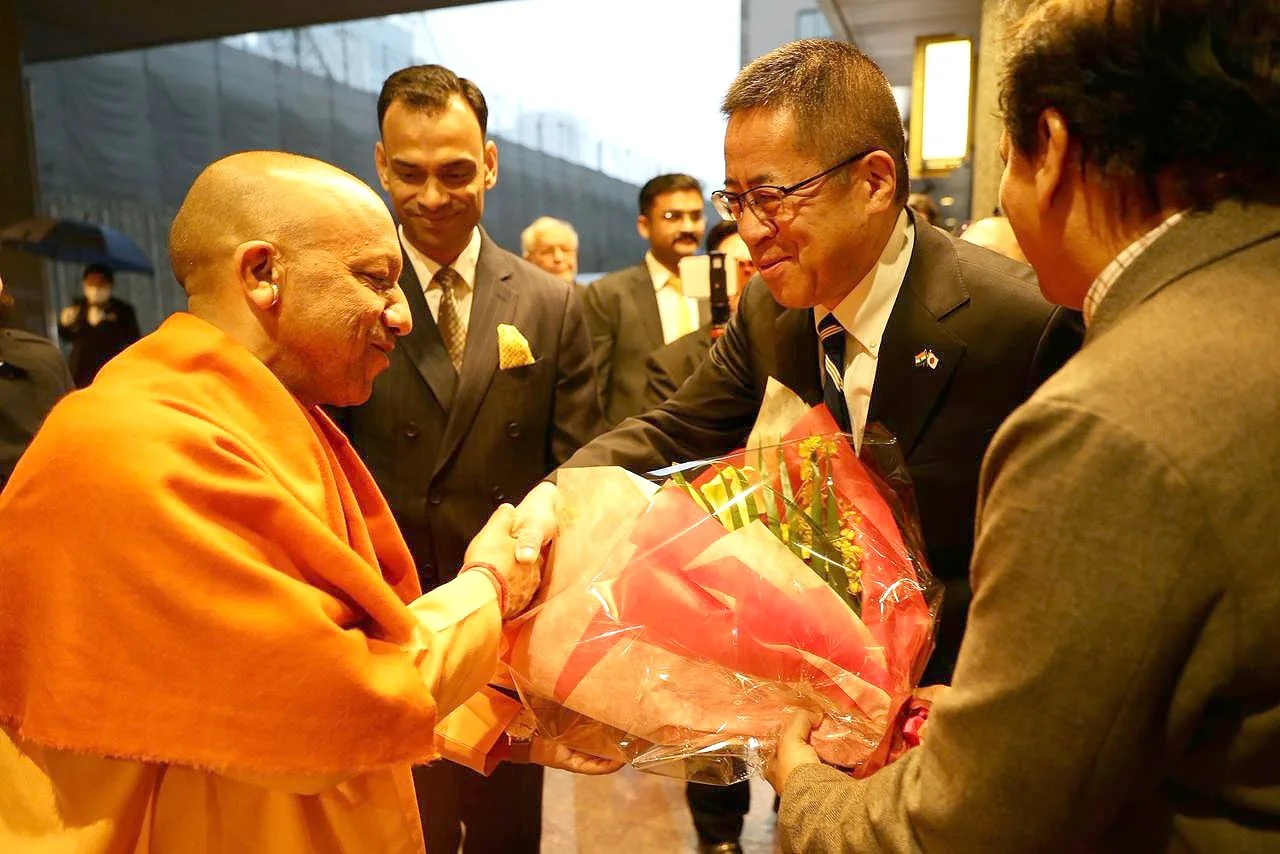 Uttar Pradesh Chief Minister Yogi Adityanath being presented with a bouquet on arrival in Japan.